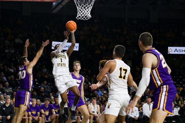 Senior guard Xavier Bell jumps for a layup past Northern Iowa defenders on Nov. 14. The Shockers went on to claim victory over the Panthers, 79-73.