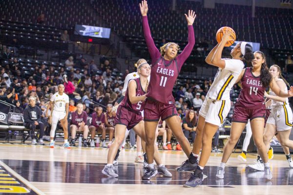 Sophomore Salese Blow takes a fadeaway shot in the first quarter against Oklahoma Christian University. Blow scored eight points on 25% shooting on Nov. 4.