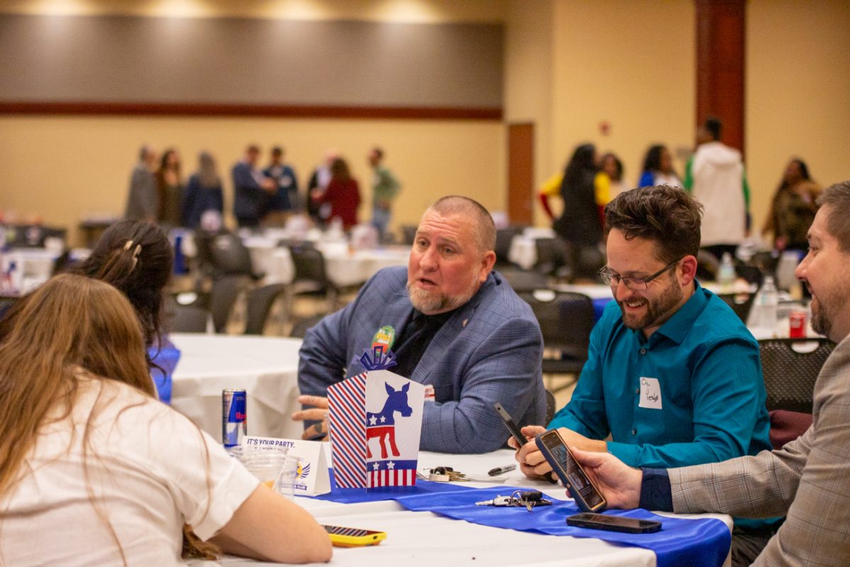 Esau Freeman, a U.S. House of Representatives candidate for Kansas, speaks to attendees at the Wichita State Young Democrats watch party on election night. Freeman lost his race to incumbent Ron Estes, according to unofficial results. 