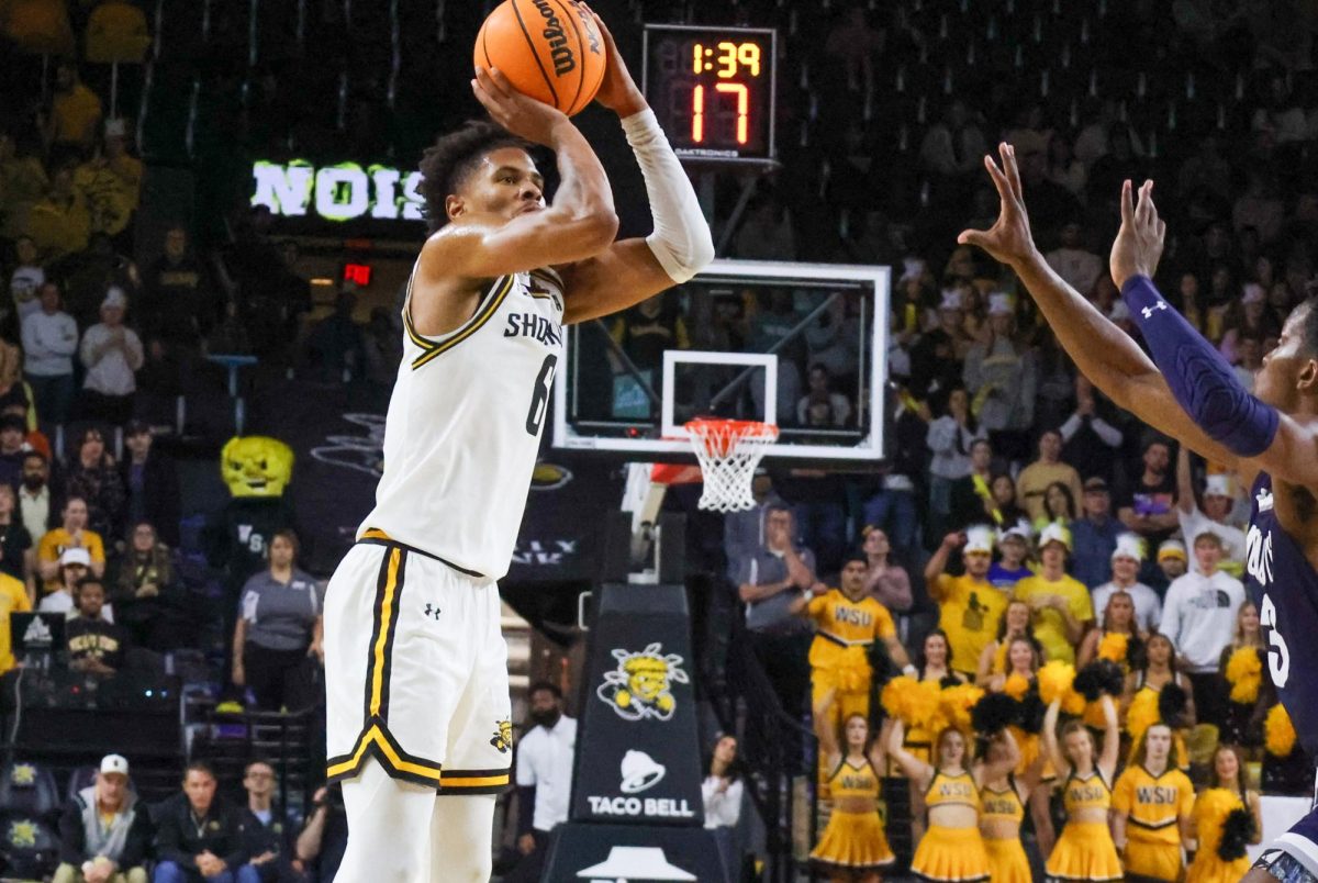 Junior forward Corey Washington shoots a go-ahead 3-pointer against Monmouth in the second half. Washington's shot would prove to be the game-winner on Nov. 18.
