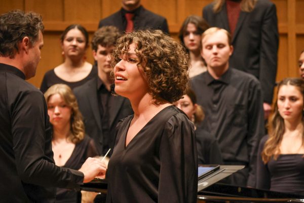 Anna Luttrell performs a solo during "Lo, How a Rose/The Rose." Luttrell was one of seven singers to perform a solo during the 61st candlelight concert.