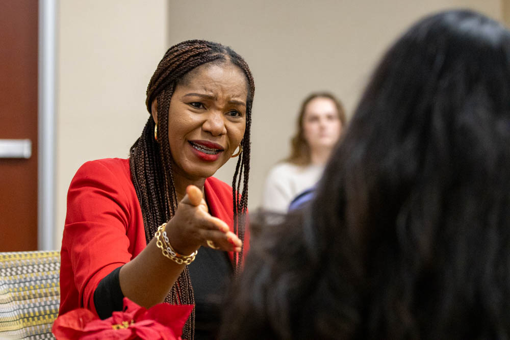 Mercy Umeri answers a question posed by Sara Mata about her recently released book during her book talk on Dec. 5. "Even if it's just one child you can buy this book for, you would have made my day," Umeri said.