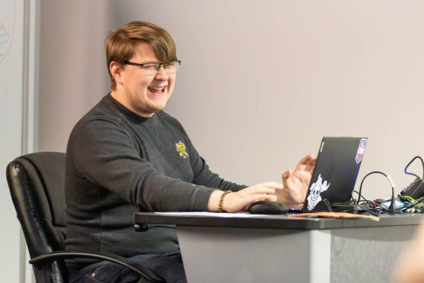 Cole Tourney, the president of Wichita State's Game Design Club, leads the group's December meeting. The club hopes to give game design students an opportunity to collaborate and create community.