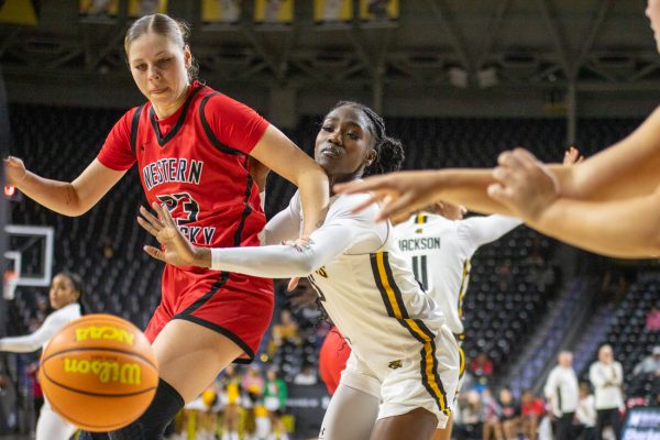 Senior forward Ornella Niankan plays defense against a Western Kentucky player on Dec. 8. Wichita State held the Hilltoppers to 28% shooting from the floor in the win.