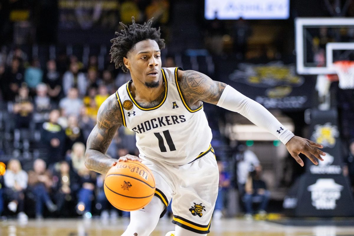 Fifth-year guard Justin Hill drives down the court, attempting to score on Kansas City. The Shockers lost to the Roos, 74-64