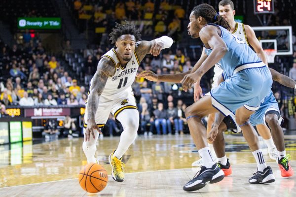 Fifth-year guard Justin Hill drives down the court, attempting to score on Kansas City. The Shockers lost to the Roos, 74-64