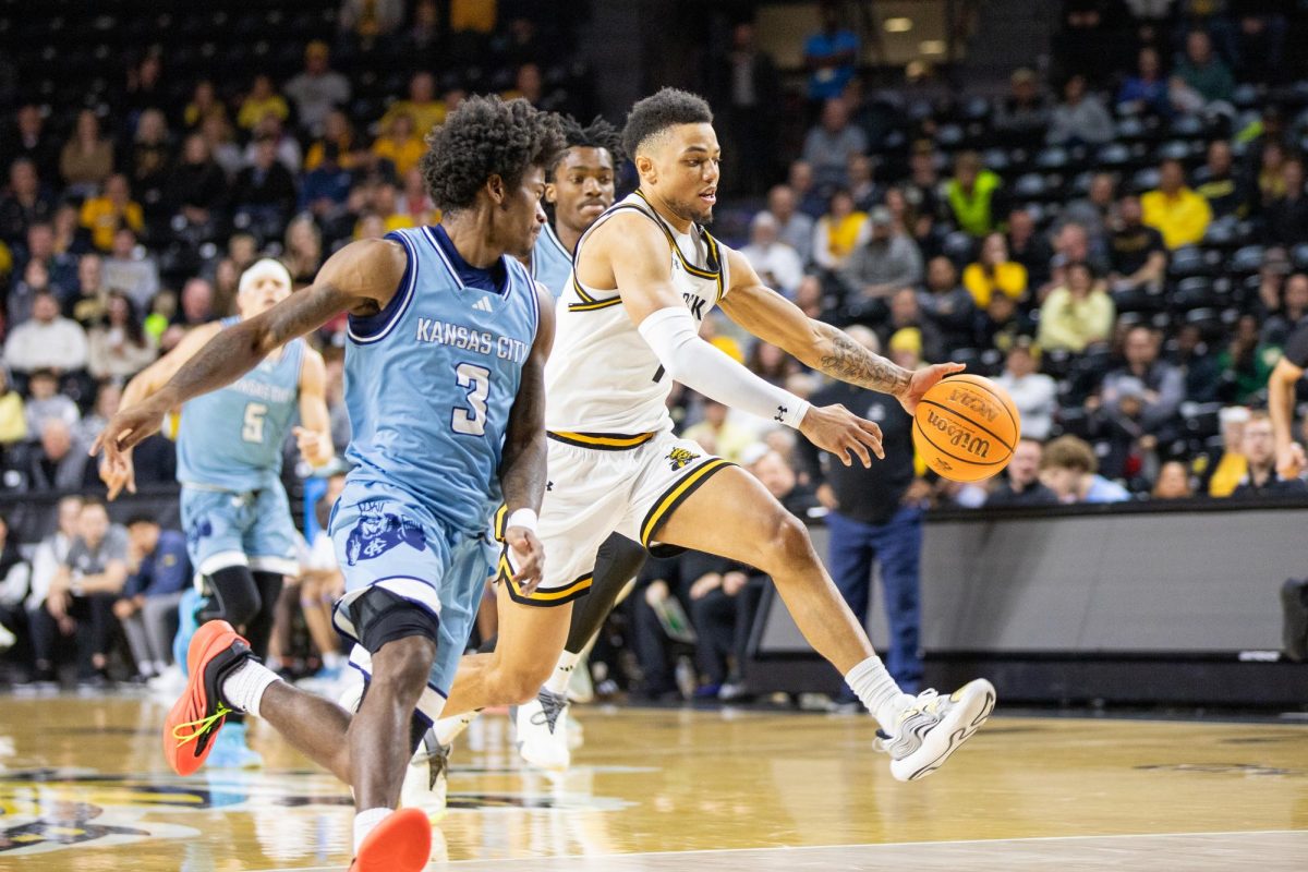 Senior guard Xavier Bell drives the ball down the court during the game against Kansas City on Dec. 17. Bell scored 21 points during the game, but the Shockers ultimately lost, 74-64, to the Roos.