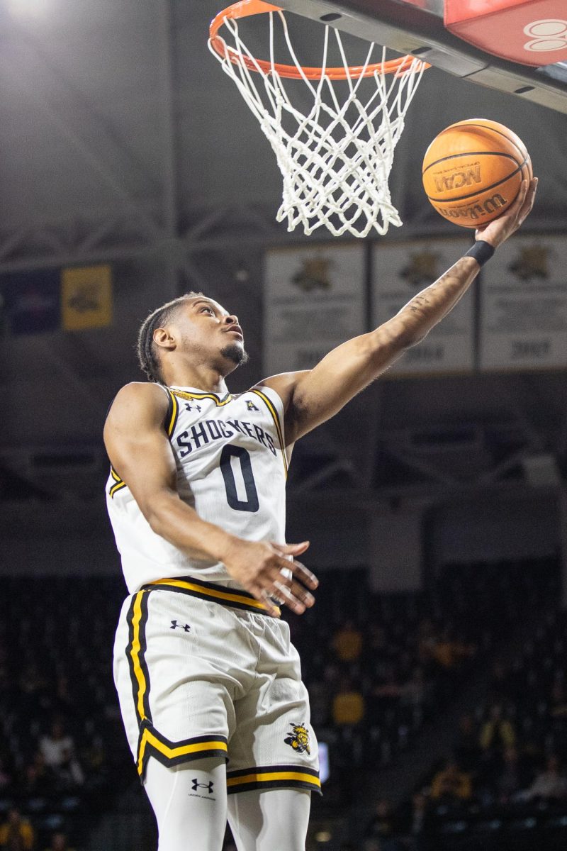 Fifth-year guard AJ McGinnis goes for a lay-up during the WSU game against Kansas City on Dec. 17. McGinnis played 15 minutes during the losing game to the Roos.