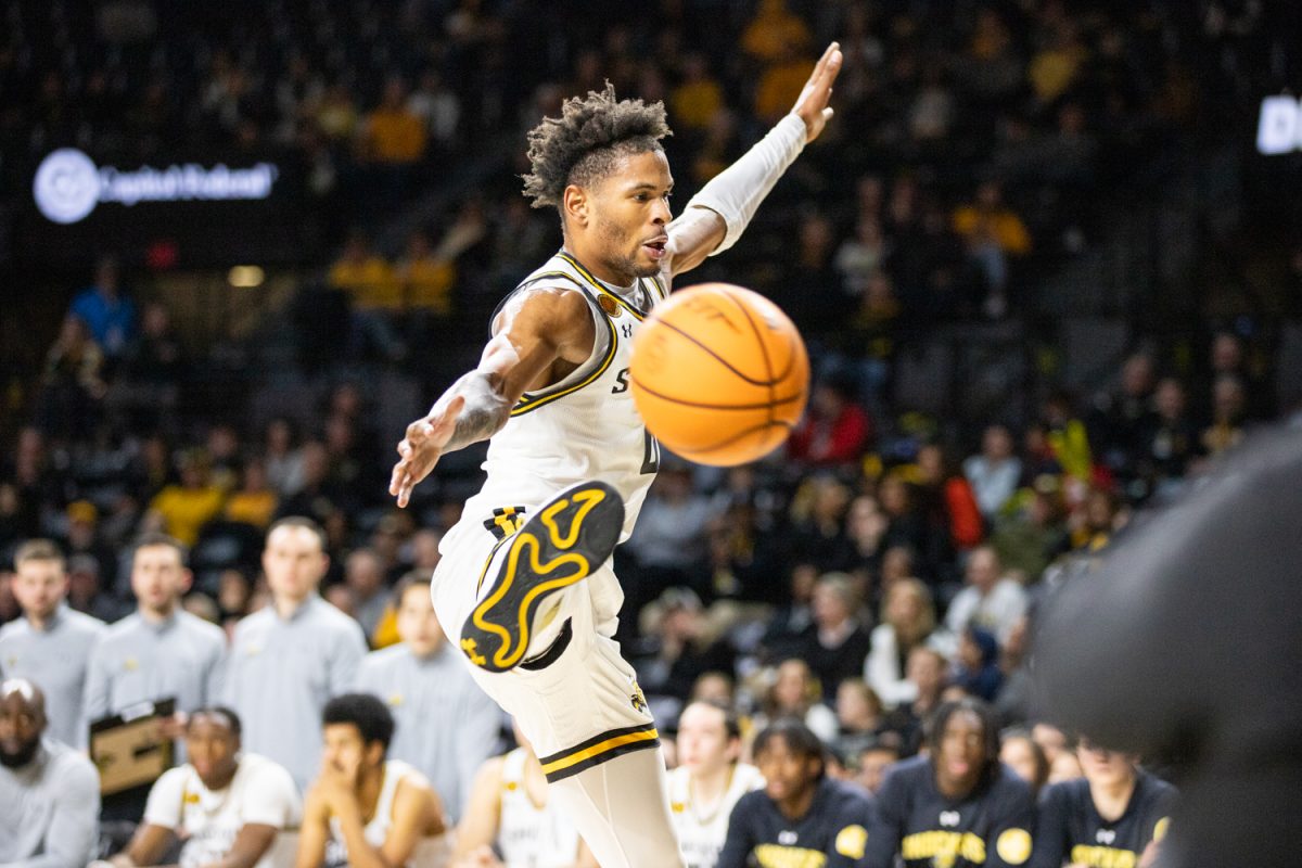 Junior forward Corey Washington attempts to block the Kansas City Roos from passing the ball into play. Washington occupied the court for nearly 30 minutes, scoring eight points.