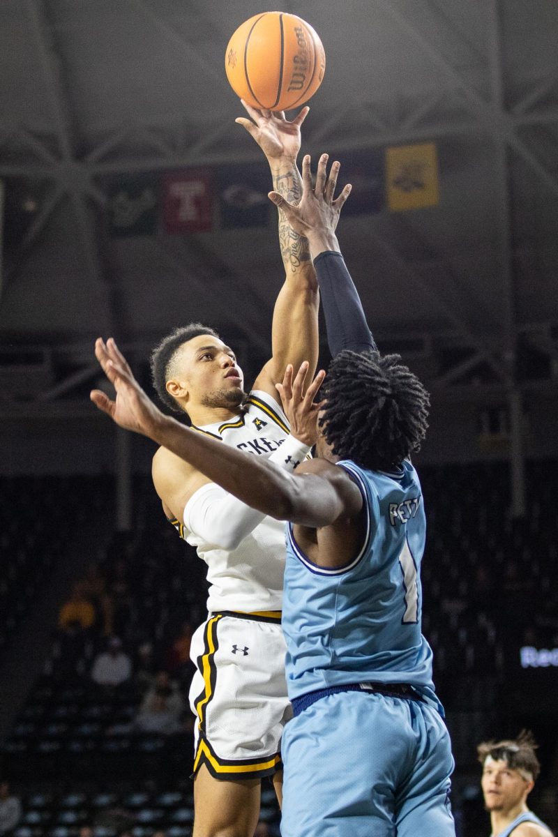 Senior guard Xavier Bell attempts to make a layup on Kansas City during the Dec. 17 game. Bell scored 21 points during the game, but the Shockers ultimately lost, 74-64, to the Roos.