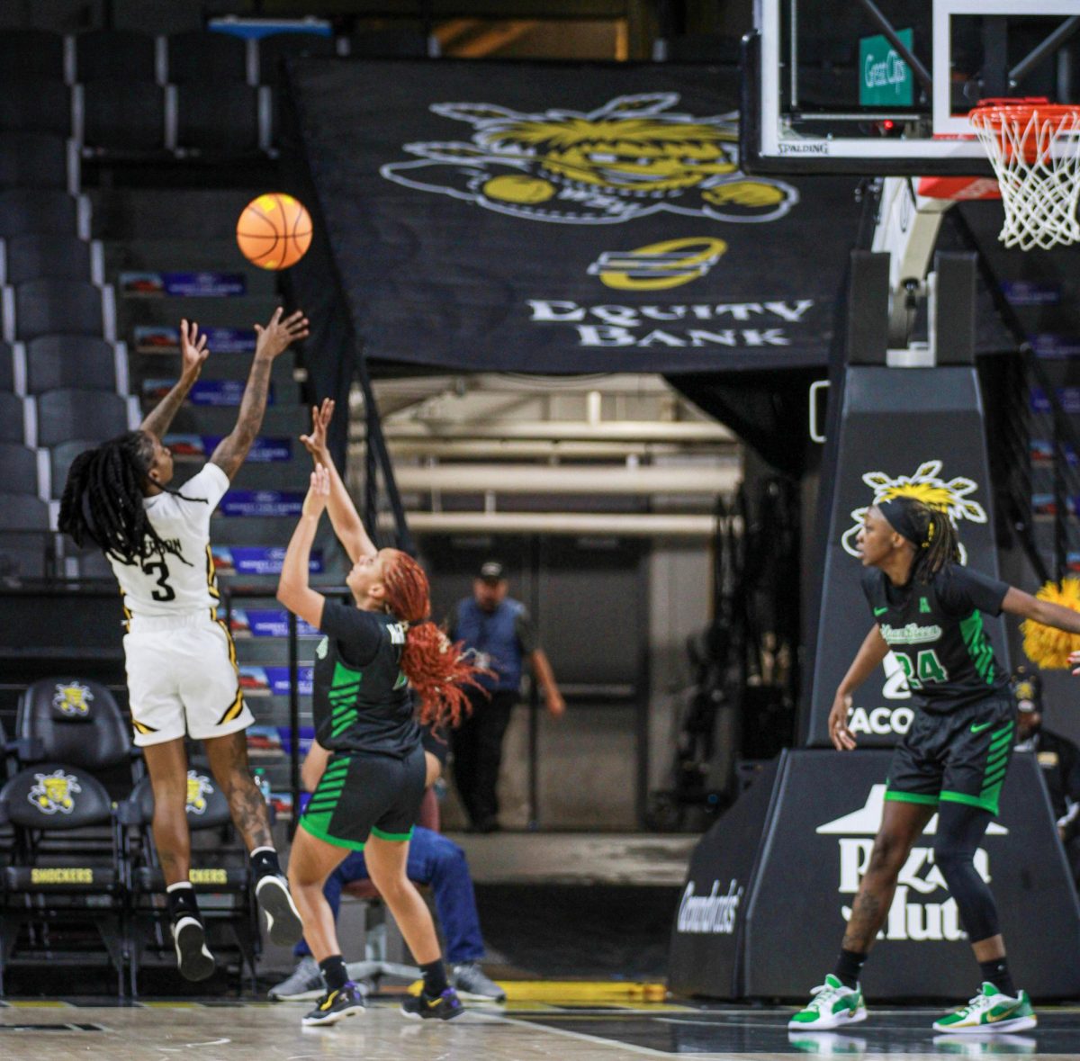 Junior guard Princess Anderson rises for a jump shot over a North Texas defender. Anderson missed the shot during the WSU loss.