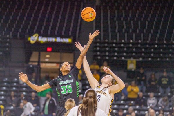 Senior center Ella Anciaux goes up for the opening tipoff of Wichita State's Dec. 29 game against North Texas. Anciaux didn't score a point in the WSU loss, 62-56.