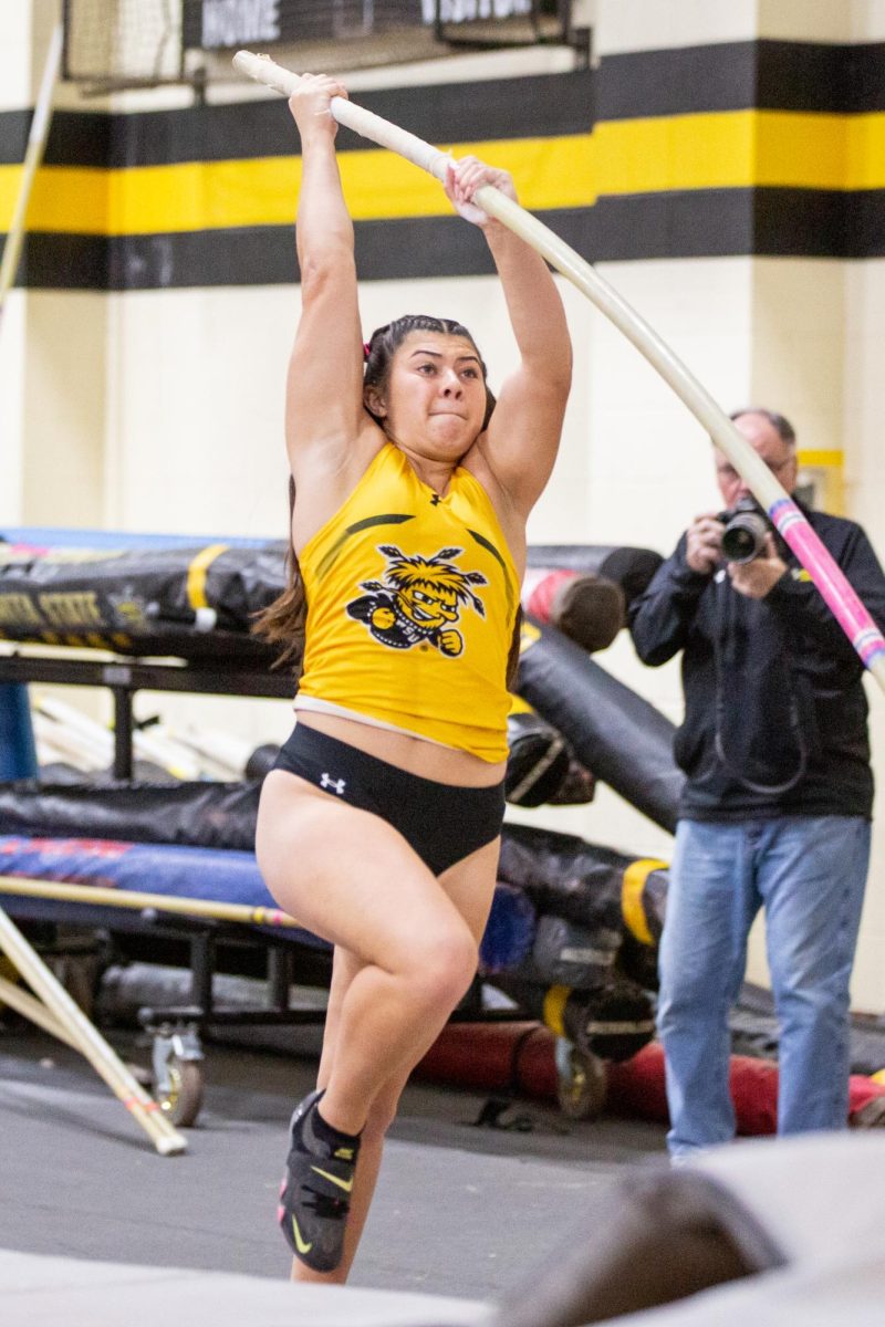 Alexis Phillips vaults up during the Black vs. Yellow Intrasquad competition on Dec. 6.