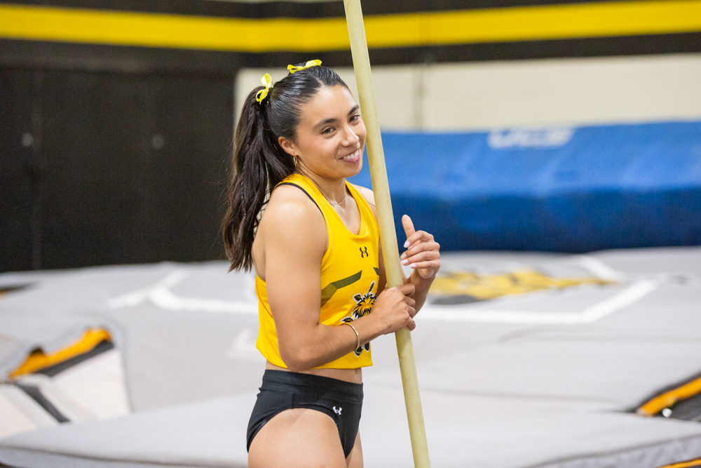 Arantxa Cortez smiles after competing in the pole vault event for track and field.