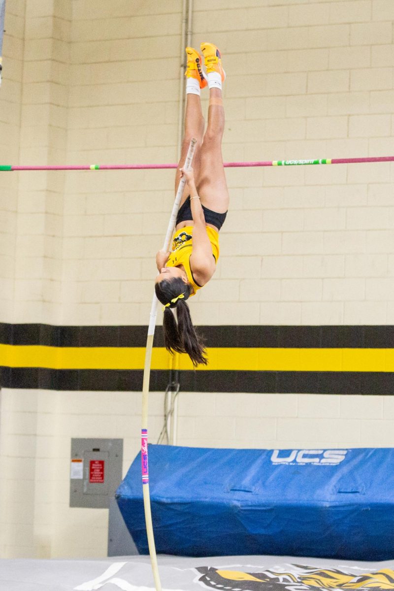 Arantxa Cortez propels herself over the pole vault bar during the Black vs Yellow Intrasquad meet on Dec. 6.