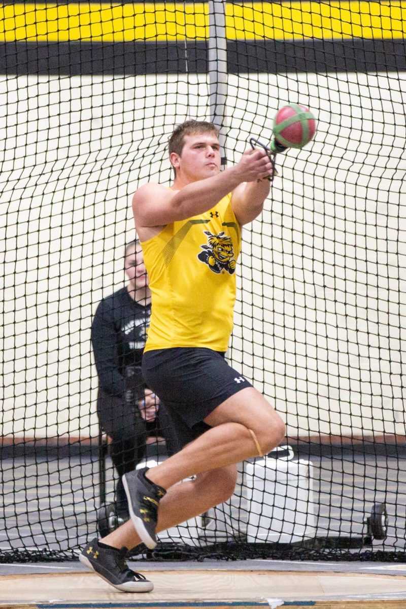 Junior Beau Kerschen pivots around during the hammer throw event at the Black vs. Yellow Intrasquad on Dec. 6.