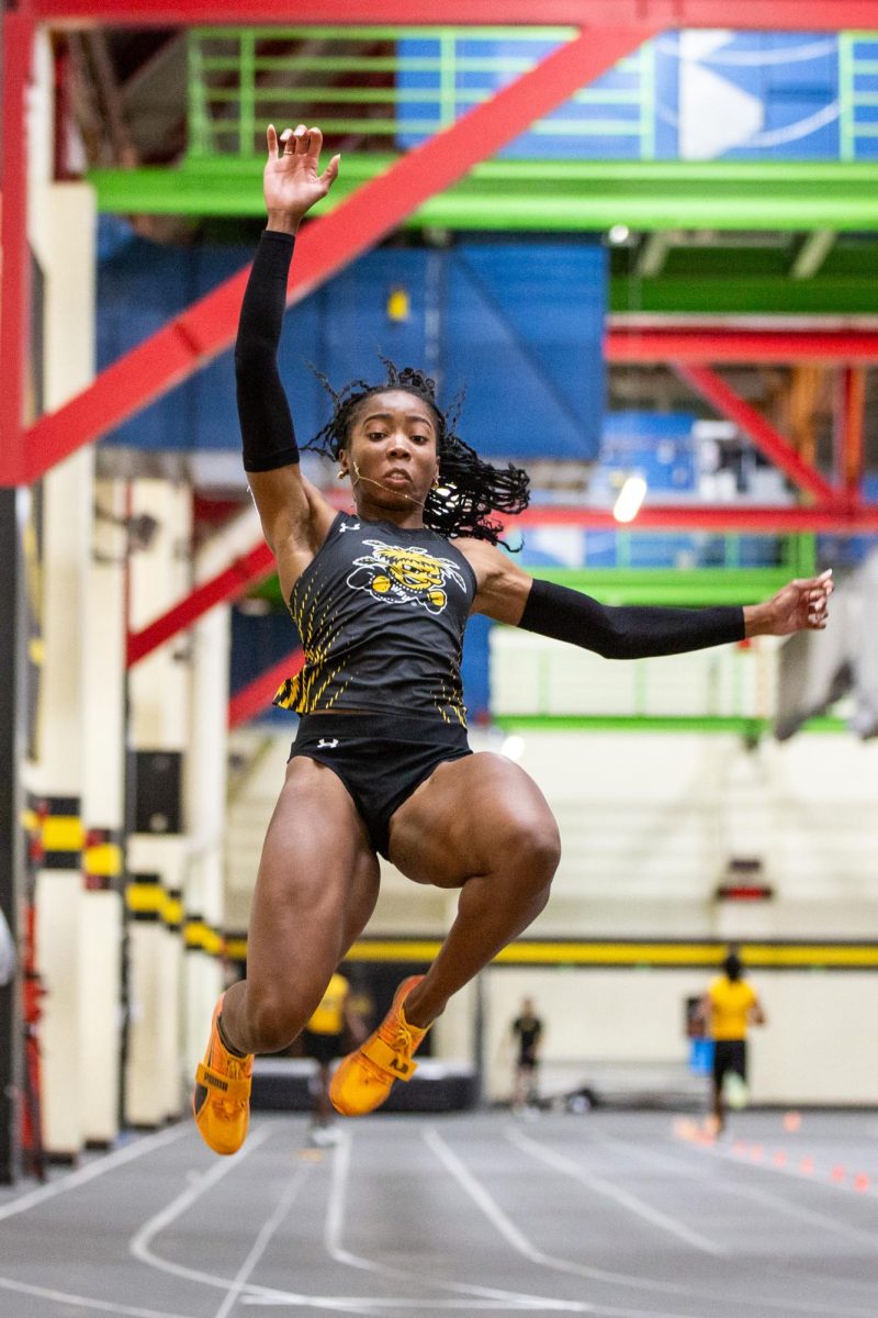 Senior Chidera Okoro leaps forward during the Black vs. Yellow Intrasquad event on Dec. 6.