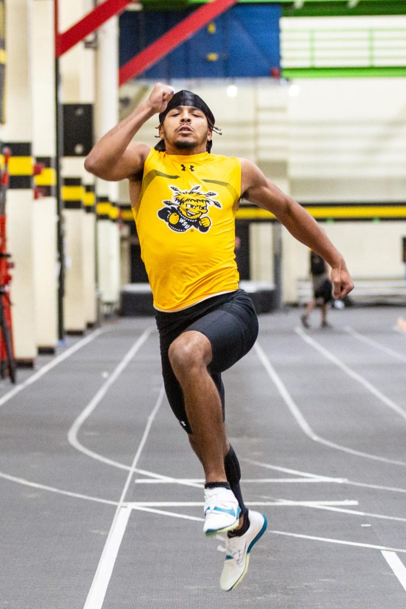 Darius Graham leaps forward during the Black vs. Yellow Intrasquad event on Dec. 6.