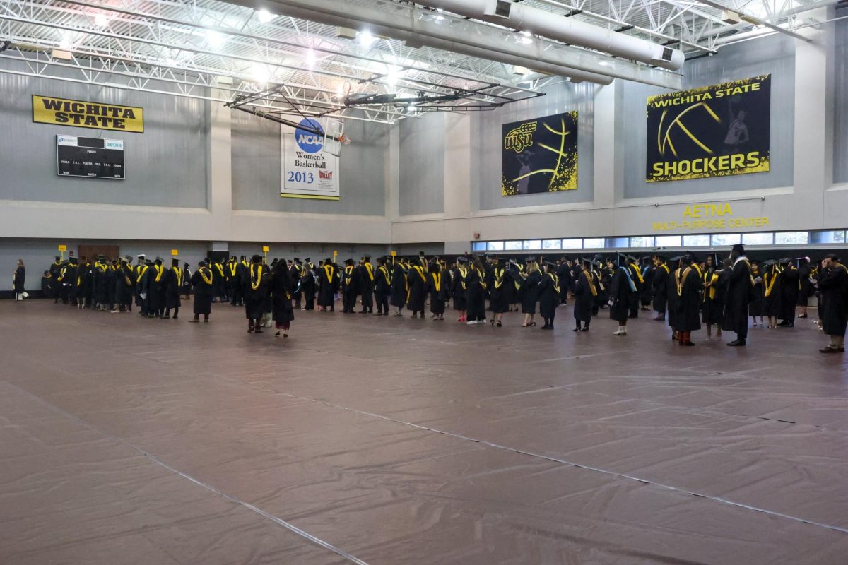 Graduates line up in the Aetna Multi-Purpose Center before the ceremony.