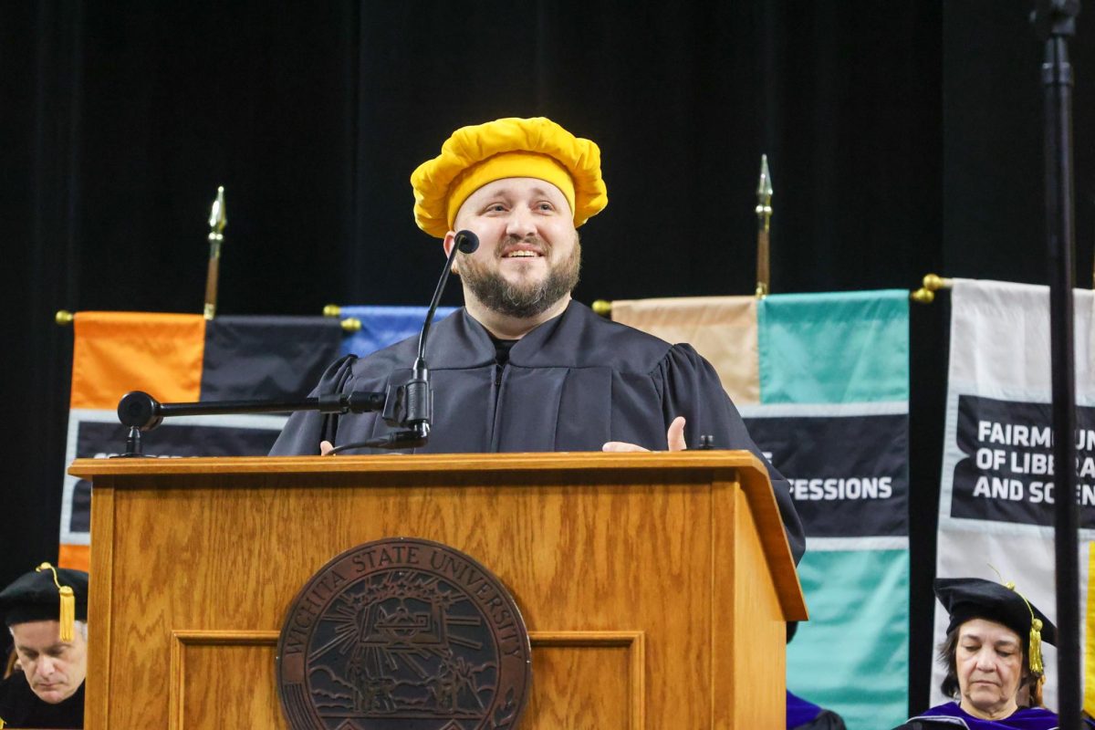 John Kirk speaks during the student welcome section of the ceremony. Kirk is the Graduate Student Council President