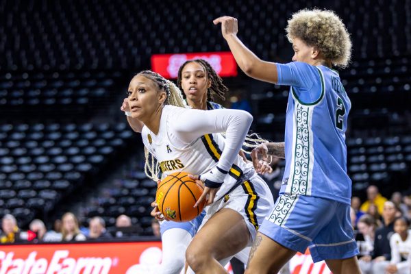 Jayla Murray pushes through the Tulane defense on Jan. 15. Murray scored 17 points and three rebounds during the game.