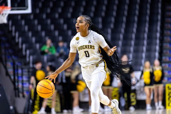 Taylor Jameson shouts to her teammates as she runs down the court in the third quarter of the Jan. 15 game against Tulane University. Jameson made one rebound and three assists in the game.