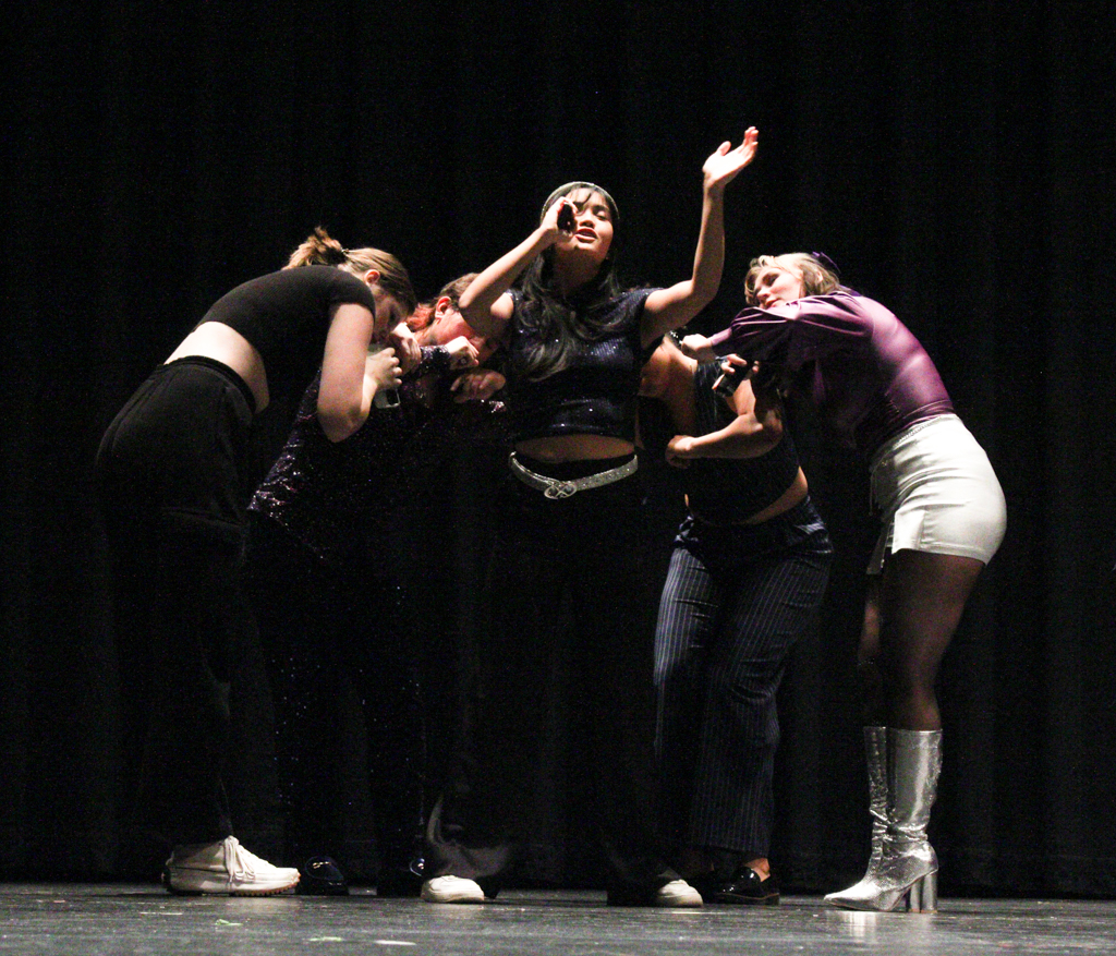 Soloist sings her heart out to Saturn by Sza. The Shockappellas hosted an open dress rehearsal in preparation for their Nebraska competition.