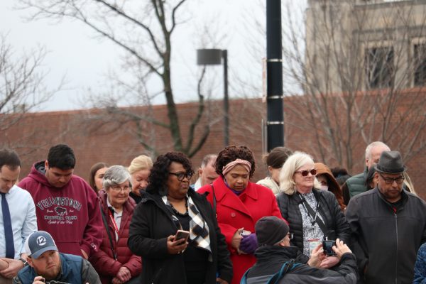 Wichita community memebrs listen to religious leaders speak at a prayer vigil. The vigil was held to mourn those who lost their lives in the 5342 crash on Wedneday Jan. 30.