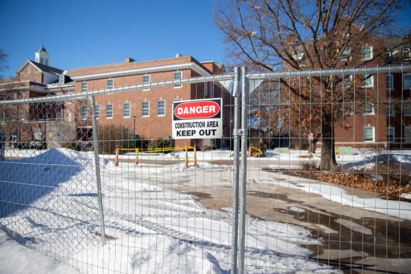 Warning signs on fences are found around the constructions on campus. The construction has continued into spring 2025 from fall 2024.