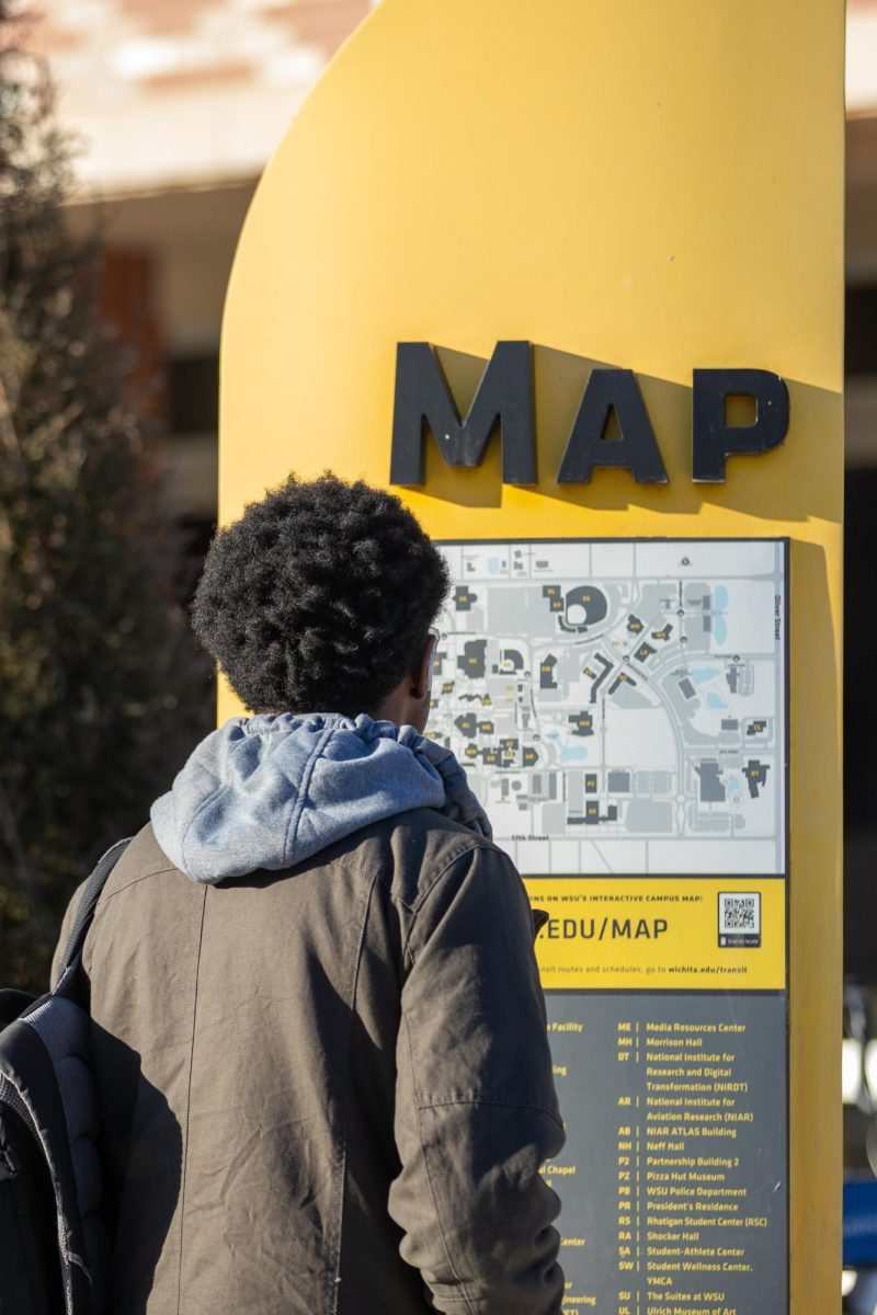 Ray-jhay Barnes looks for Devlin Hall on a campus map near the Rhatigan Student Center on the second day of the spring semester.