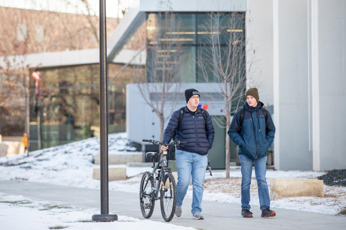 Kyan Tenpenny, mechanical engineering major, and Damyin Allmond, aerospace engineering major, walk on campus together. 