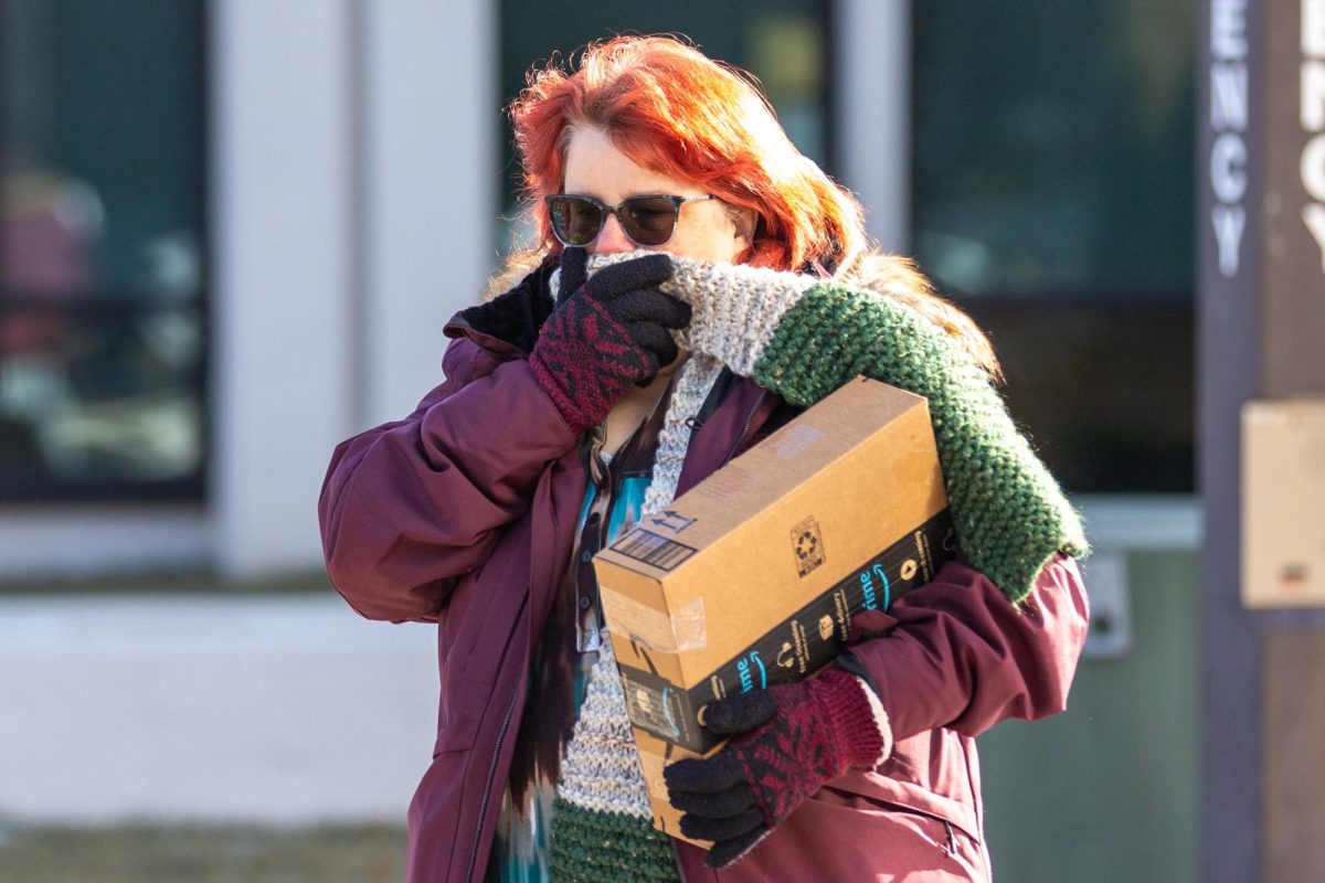 Barbara Myers, an administrative specialist in the College of Engineering, bundles up while walking to the on-campus post office on Wednesday, Jan. 22.