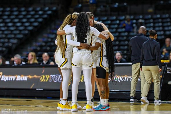 The Wichita State women's basketball team takes a moment with each other before their game against South Florida on Jan. 8. Wichita State eventually lost to the Bulls.