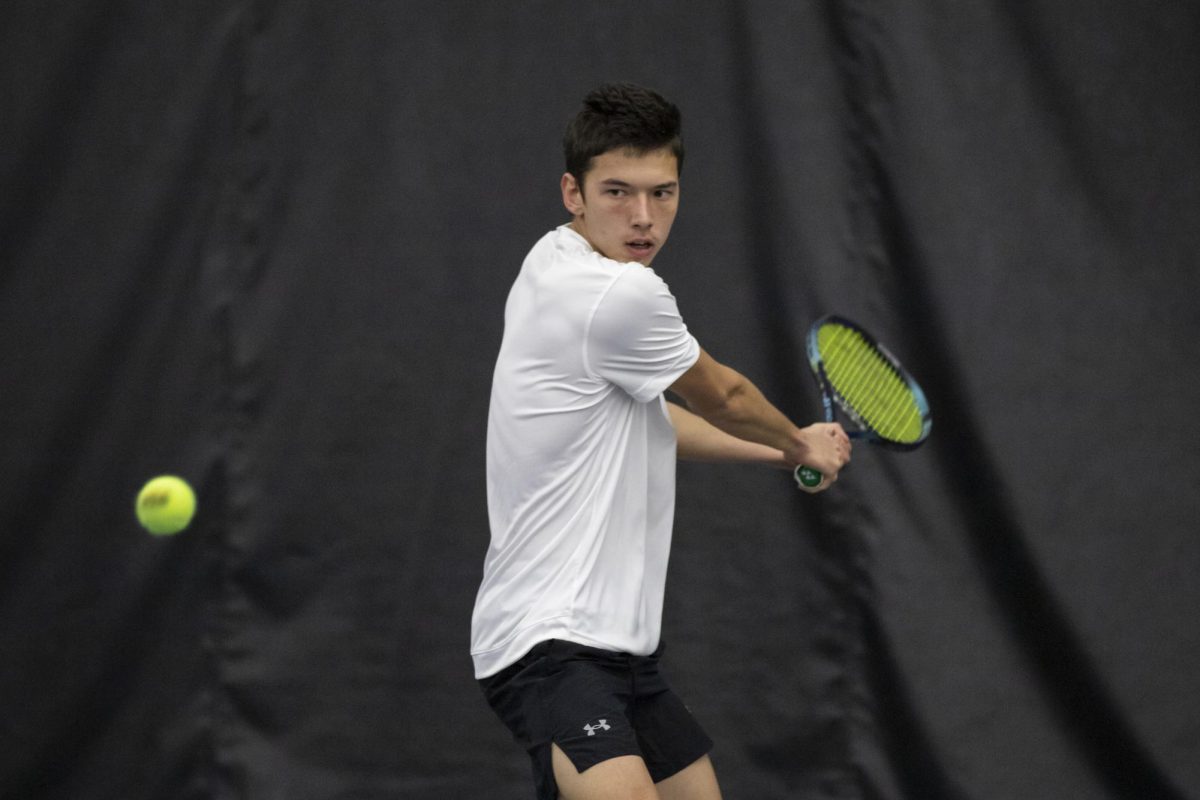 Freshman Amir Milushev returns the ball during Wichita State's tennis match against Drake on Jan. 26. Milushev picked up a singles win during Wichita State's sweep.