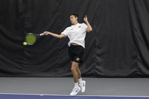 Freshman Amir Milushev returns the ball during Wichita State's tennis match against Drake on Jan. 26. Milushev picked up a singles win during Wichita State's sweep.