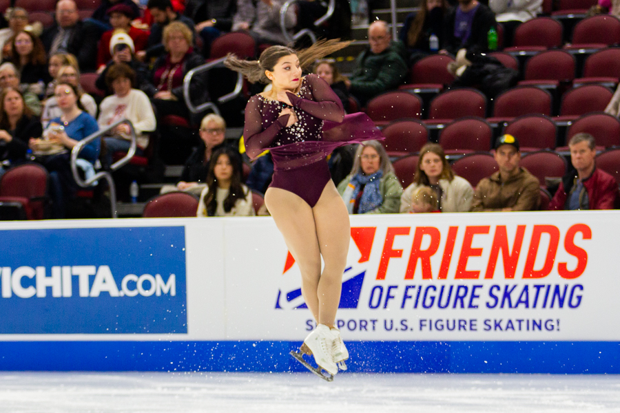 Sydney Cooke leaps and twirls over a spray of ice during her Championship Pairs / Short Program performance. Cooke and her partner, Matthew Kennedy, placed 10th with a score of 55.43.