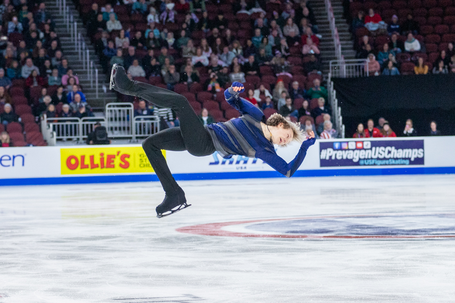 Ilia Malinin twists mid-air during his Championship Men / Short Program performance. Malinin placed first in the competition, earning his third straight U.S. figure skating title.