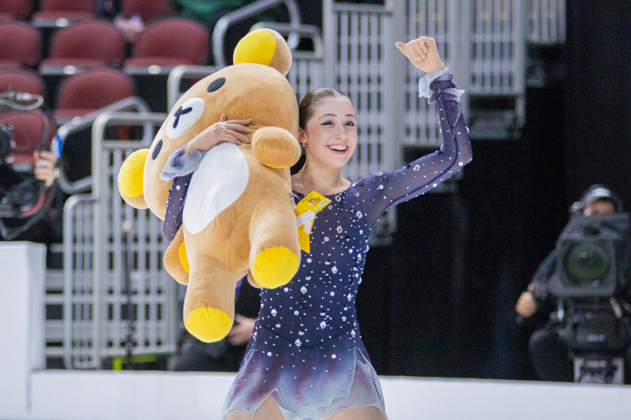 Mia Kalin holds up a triumphant fist while holding a giant Rilakkuma plush after her Championship Women performance. Kalin placed seventh with a score of 62.07 during the 2025 Prevagen U.S. Figure Skating Championships' competition on Jan. 23.