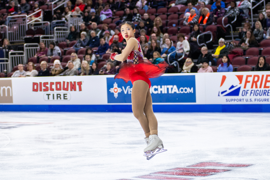 Championship women competitor Sherry Zhang twists mid-air during her Short Program performance. Zhang placed fifth with a score of 67.42.