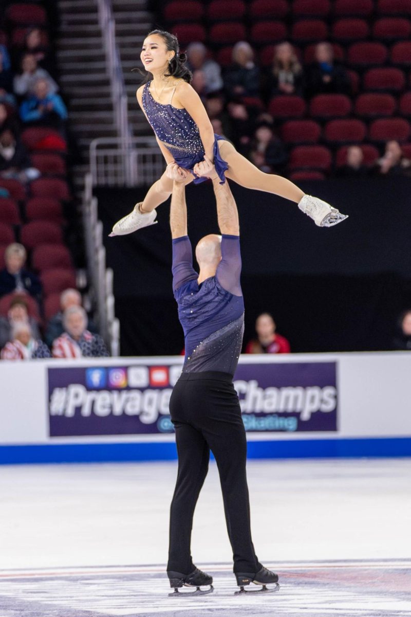 Danny O'Shea lifts skating partner Ellie Kam during the pair's Short Program performance. The duo came in first place with a score of 77.19.