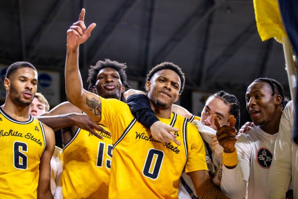 A.J. McGinnis celebrates with his Wichita State teammates after WSU's win on Feb. 12. Wichita State defeated the UTSA Roadrunners, 69-64.