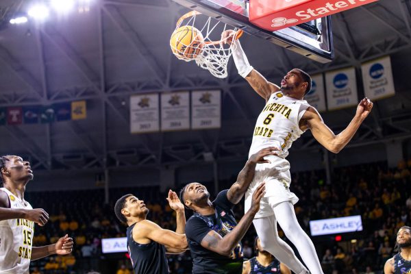 Corey Washington dunks the ball during the second half on Feb. 16. Washington scored 18 points and had 15 rebounds against Memphis.