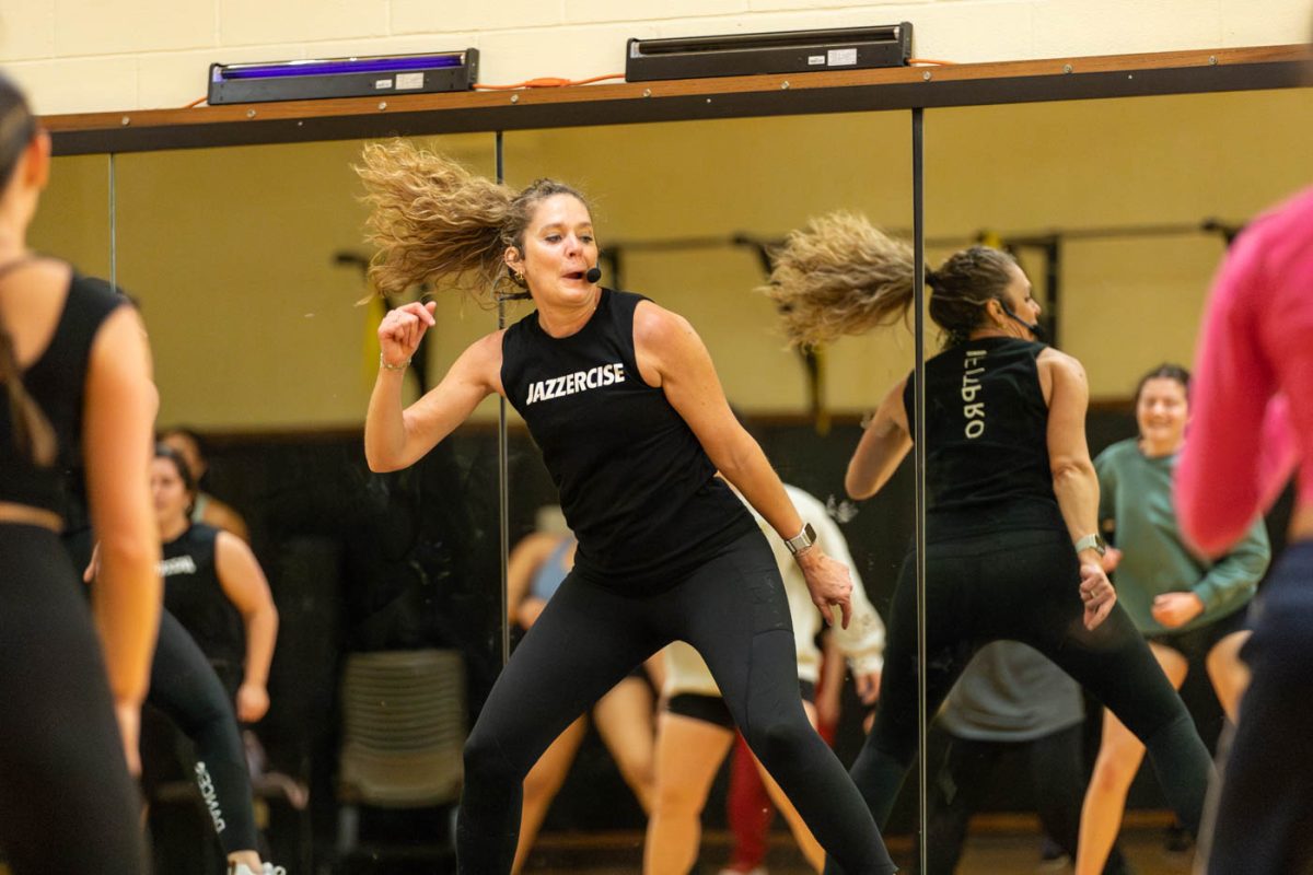 Kristi Conaway helps lead one of the jazzercise routines on Feb. 25. Jazzercise was offered in the Heskett center by CHAARG, a new women-only workout group on campus.