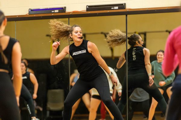 Kristi Conaway helps lead one of the Jazzercise routines on Feb. 25. Jazzercise was offered in the Heskett center by CHAARG, a new women-only workout group on campus.