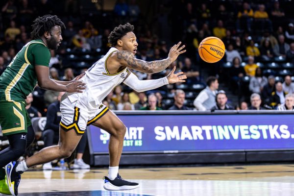 Fifth-year guard Justin Hill grabs for the ball during the first half on Feb. 27. Hill scored one point in the game against UAB.