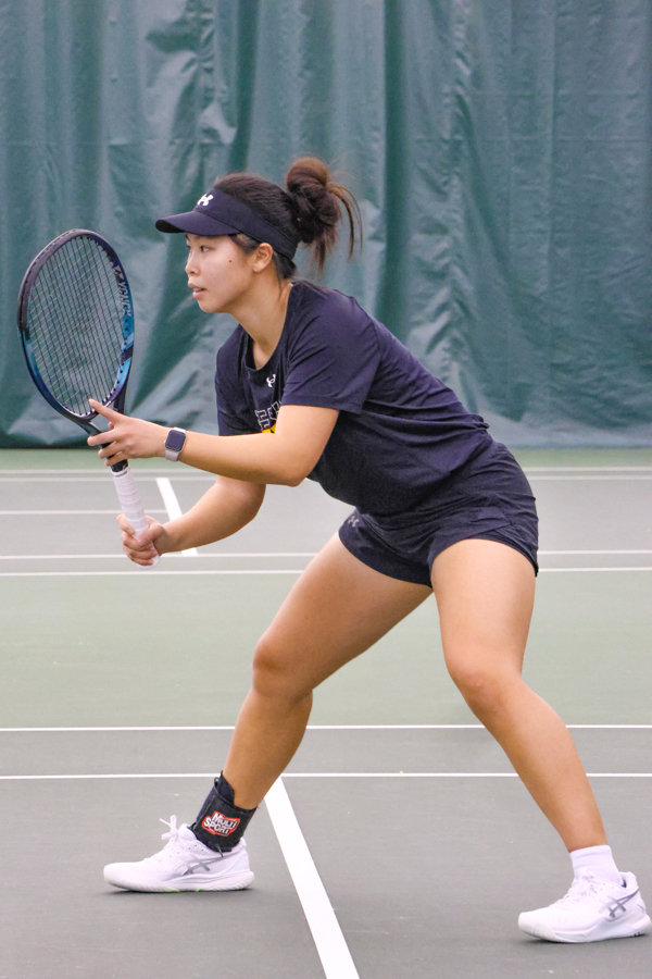 Sophomore Xin Tong Wang prepares to receive the ball on Feb. 5 at the season home opener against Oral Roberts. The Shockers won, 7-0, in a sweep.