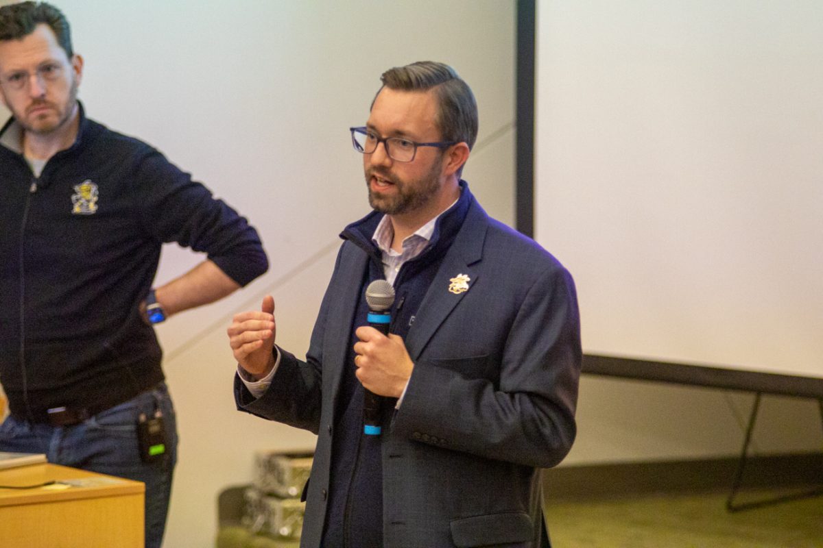 Chief of Staff and Executive Director of Government Relations Zach Gearhart addresses the concerns of Wichita State faculty during the Faculty Senate meeting on Feb. 10. (File photo)