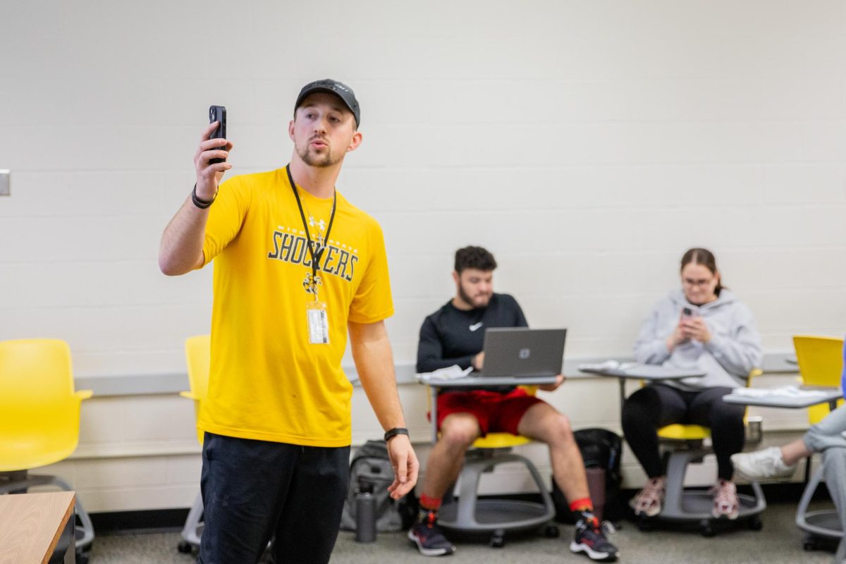 Adjunct instructor Remington Putter shows his Health, Movement and Physical Activity class how to view their screen time. Putter took an average of the class's screen time and showed students how much money they could make per week if they were paid for their screen time. He offered the class an incentive to lower their screen time. "Here's the big thing: If you can get (your screen time daily average) under one hour for a whole week, I will give you $20 cash," Putter told his class.