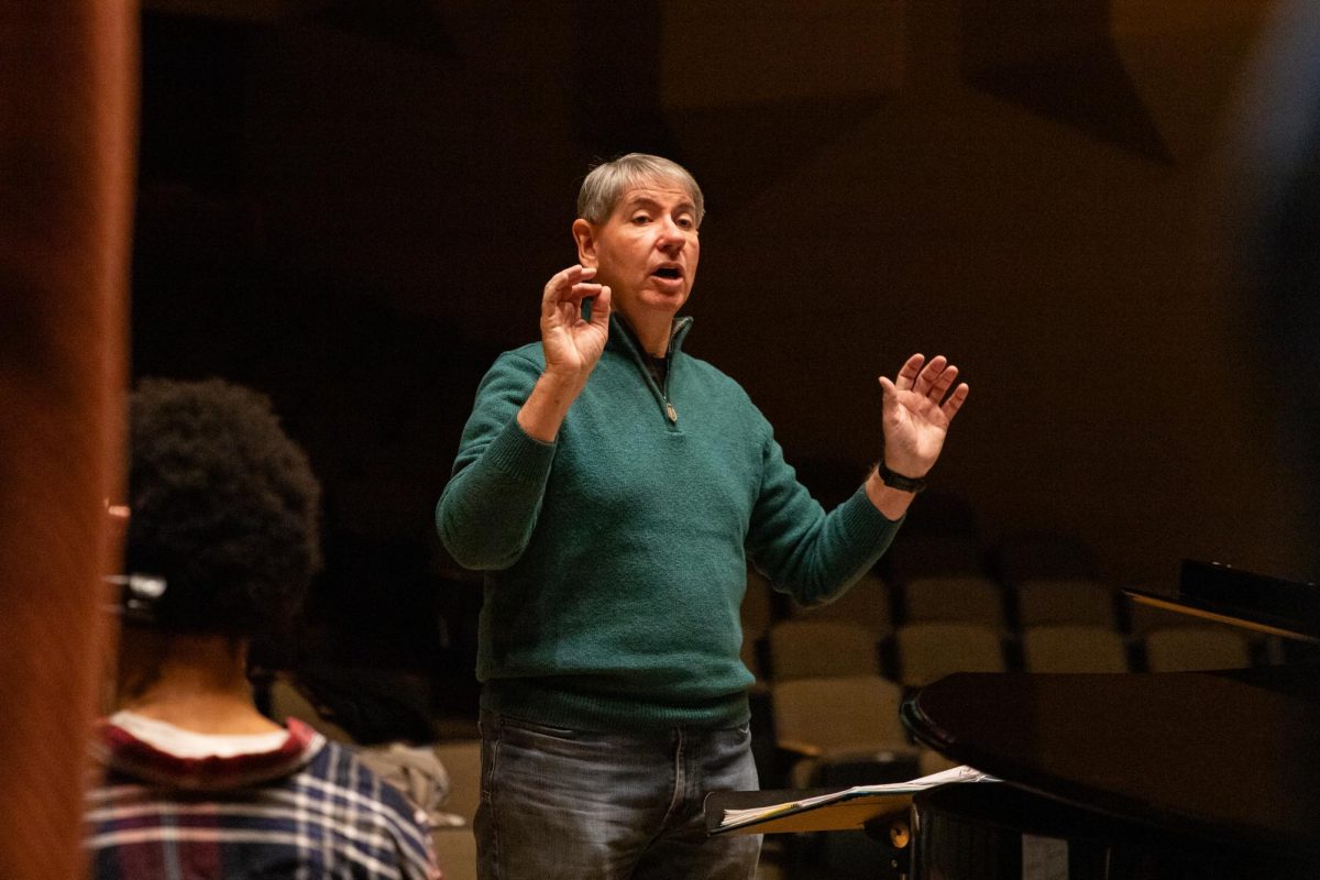 Music professor Tom Wine leads the Shocker Choir in rehearsal for their upcoming concert. Wine will retire from Wichita State University and higher education this spring.