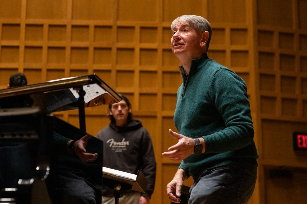 Music professor Tom Wine leads the Shocker Choir in rehearsal for their upcoming concert. Wine will retire from Wichita State University and higher education this spring.